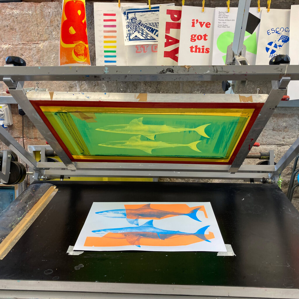 Shark Tank Orange and Blue - Screen Print - process shot on vacuum bench