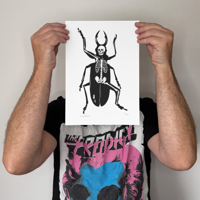 Screen Printed Insect Poster - Metamorphosis_Small A4 Size - scale shot. Featuring my collage design based on the Franz Kafka story of a man turning into an insect.